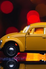 Preview iPhone wallpaper Yellow toy car, light circles, glare
