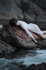 Preview iPhone wallpaper Girl sleep on stone