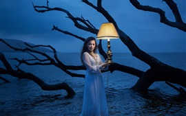 Preview wallpaper Girl standing in water, lamp, night